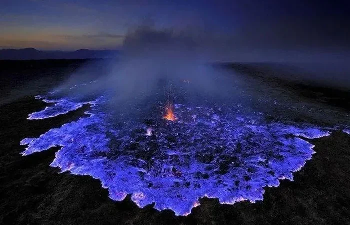 Blue sulfur flames at a volcanic vent