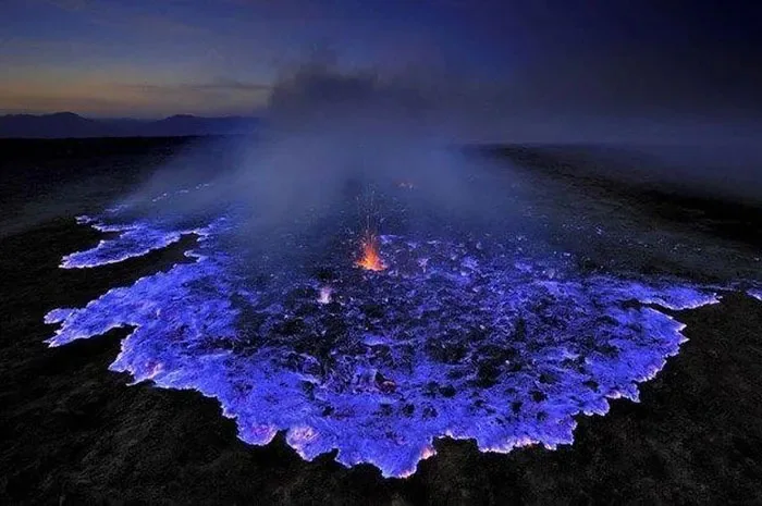 Blue sulfur flames at a volcanic vent
