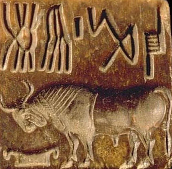 Carved Indus seal with animal motif and signs