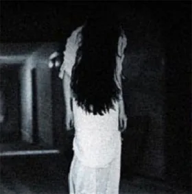 Staged ghostly figure illustrating a sensed-presence discussion