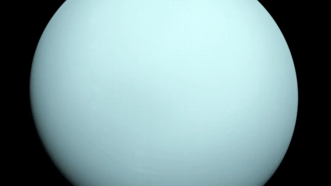 Voyager 2 view of the blue-green disk of Uranus.