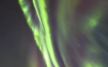 Colored auroral light across the northern night sky