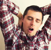 Person yawning with eyes closed